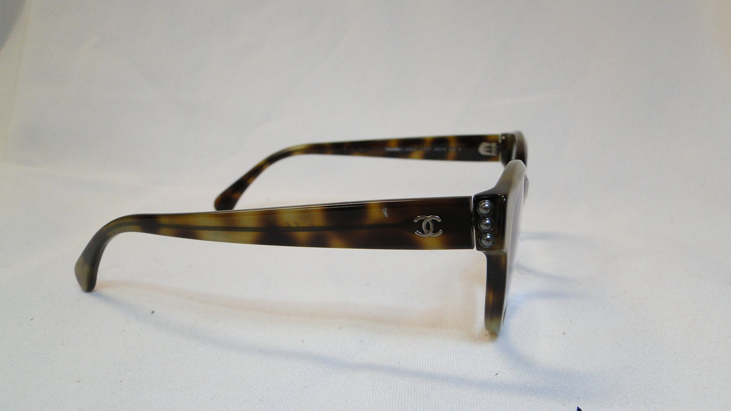 Chanel eyeglasses with a brown tortoiseshell frame