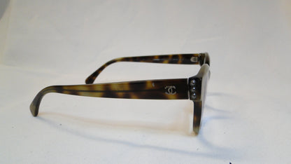 Chanel eyeglasses with a brown tortoiseshell frame