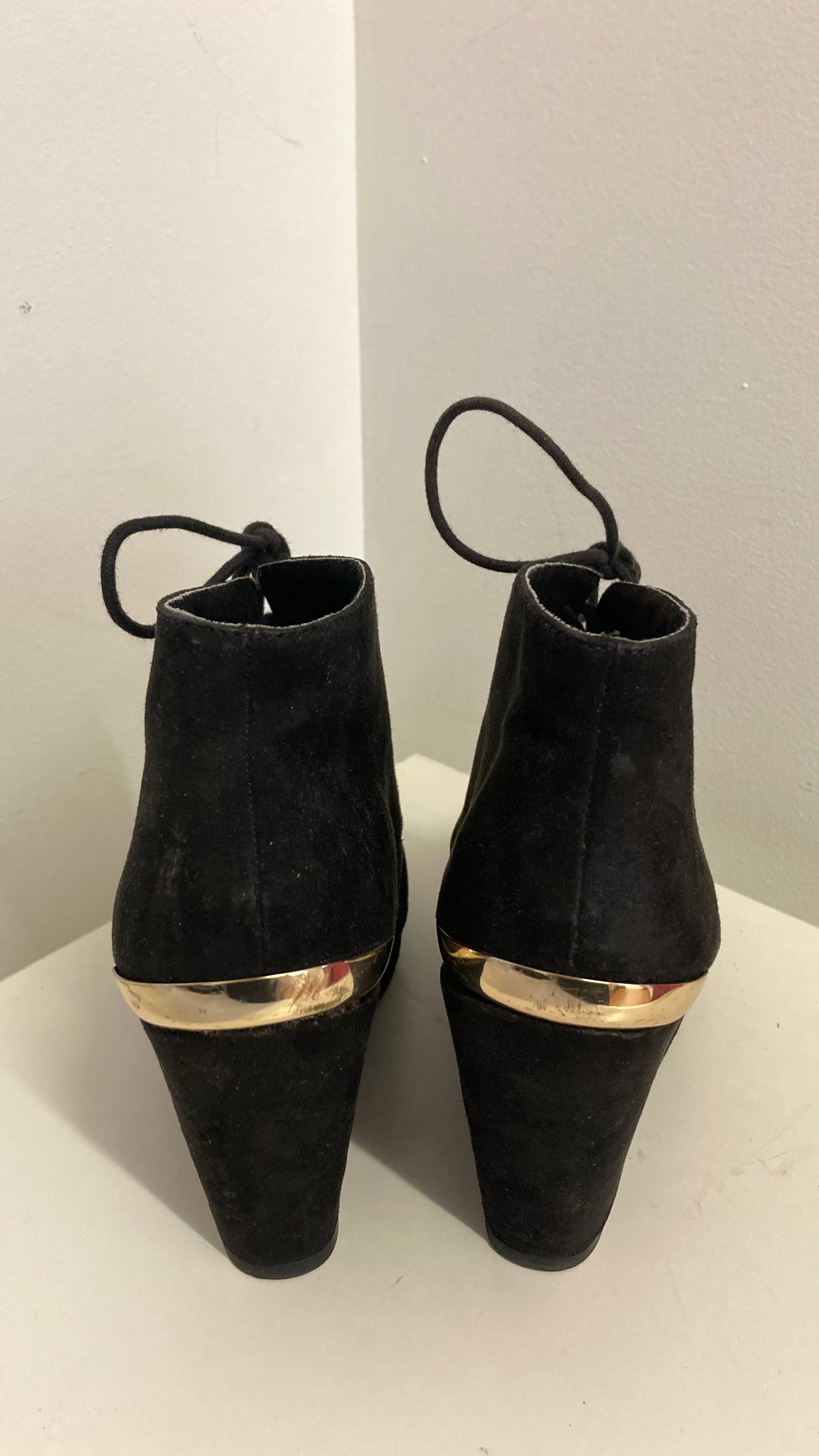 Black Faux Suede Wedge Booties With Gold Accents