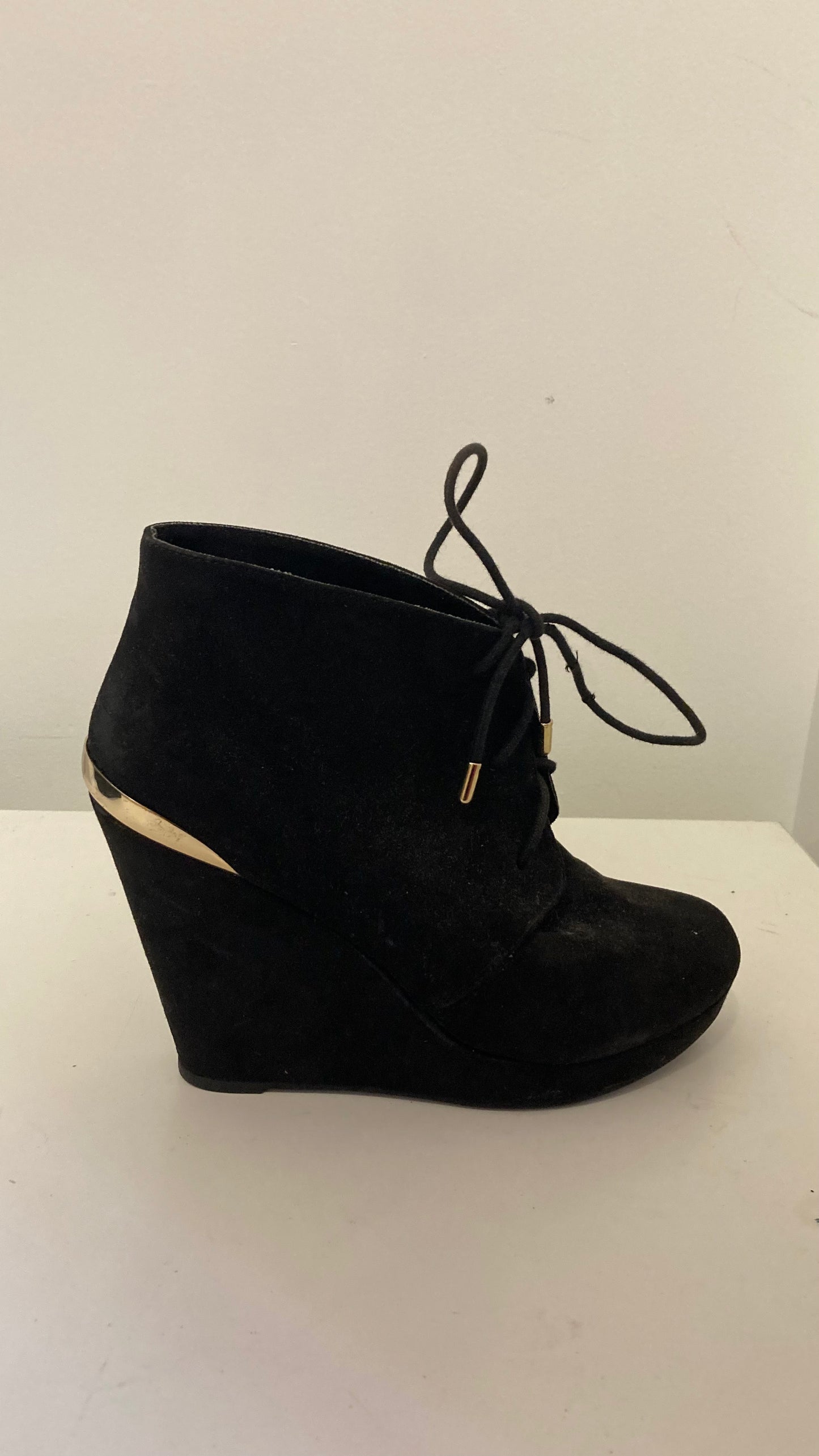 Black Faux Suede Wedge Booties With Gold Accents