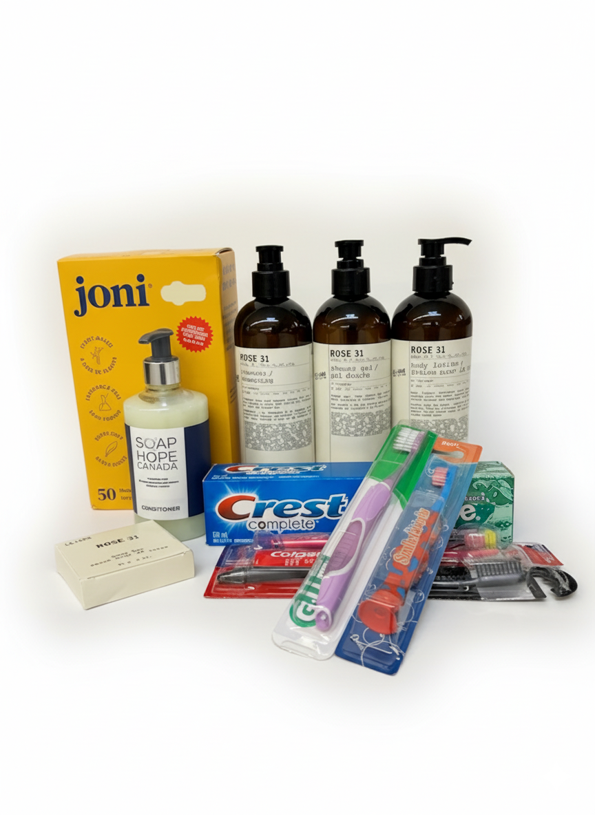 Collection of personal care products including shampoo, conditioner, lotion, body wash bottles, a toothpaste, toothbrushes, and period products.